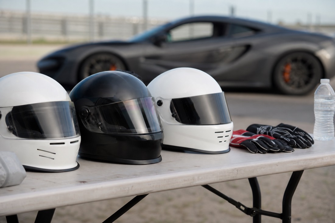 A racing helmet and gloves laid out before a Las Vegas track day